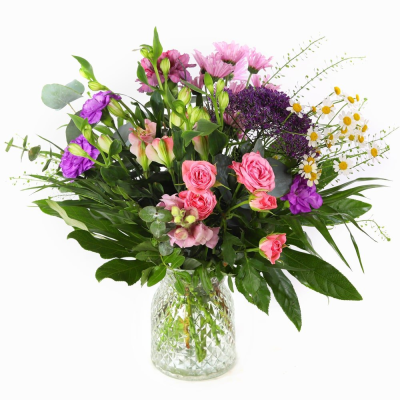 Wild Blossom  - A petite vase arrangement that captures the carefree beauty of a summer meadow. Wild Blossom blends soft, harmonious tones with fresh greenery to create a design that feels natural, joyful, and effortlessly uplifting.