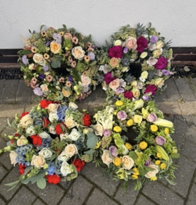 Wreaths florist choice - A beautiful wreath made in and colour preference but leave the seasonal flowers to you florist. This way you get the best value at the time.